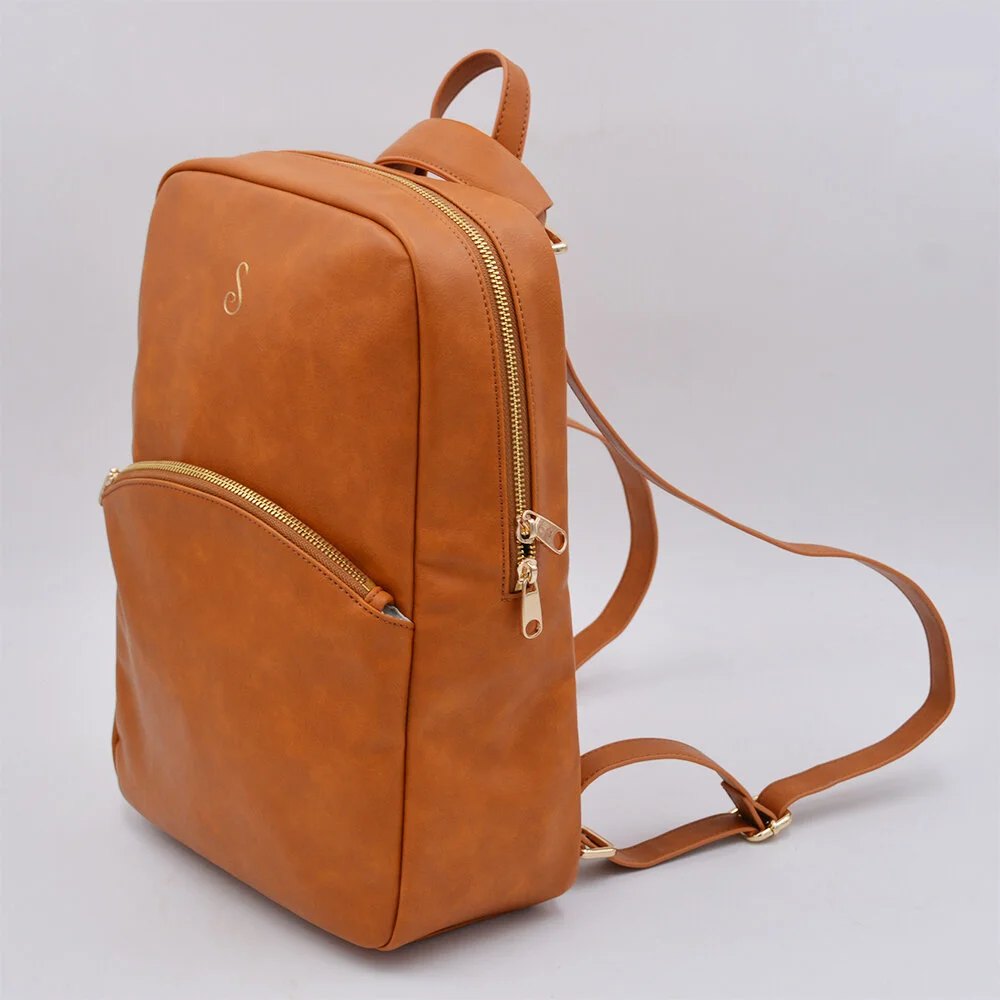 The Sosi Leone convertible backpack in cognac with gold zippers and S monogram
